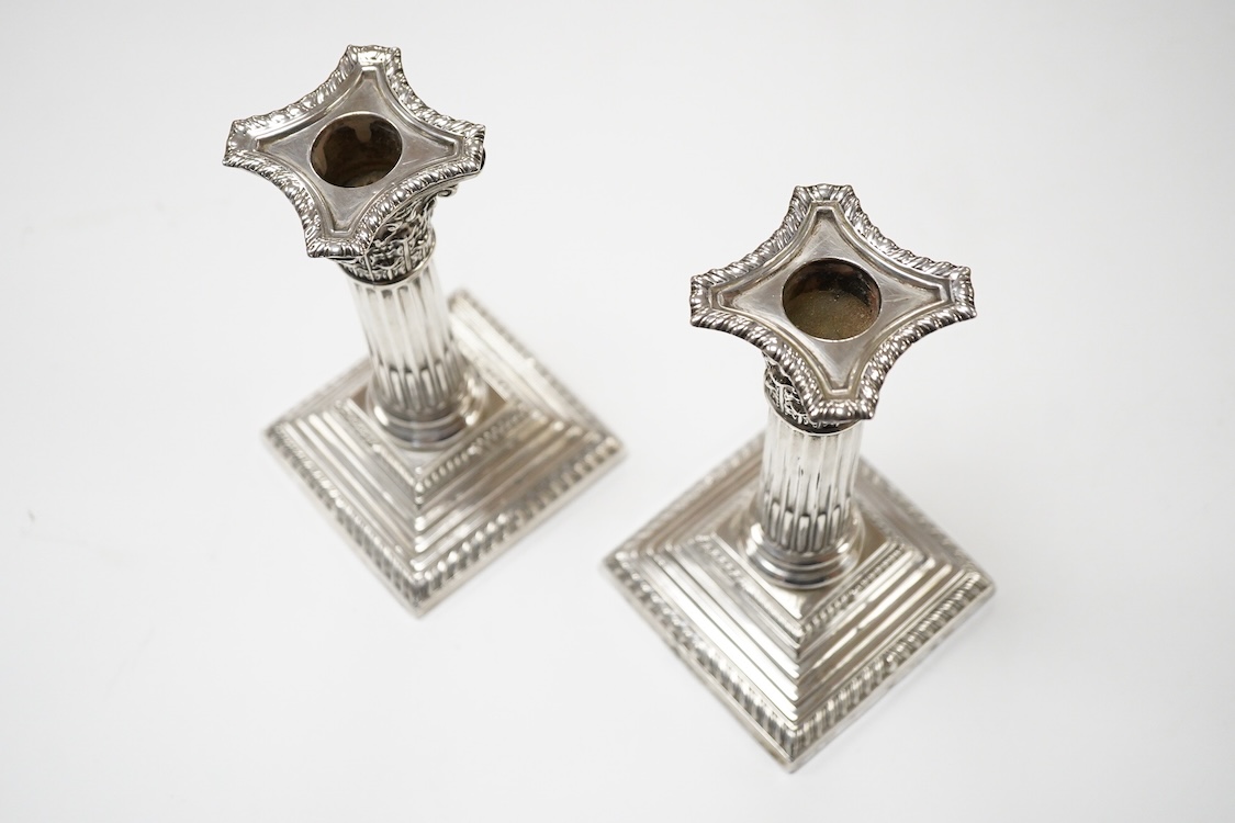 A pair of Edwardian silver mounted Corinthian column dwarf candlesticks, by Jay, Richard Attenborough Co Ltd, Sheffield, 1905, height 16.3cm, weighted.